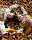 Cute Child Girls On Autumn Leaves Carpet wallpaper 128x160