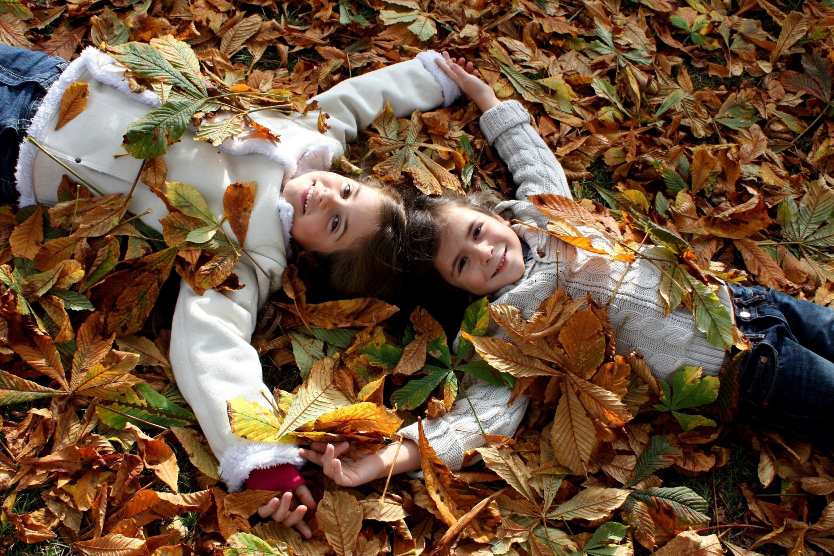 Cute Child Girls On Autumn Leaves Carpet wallpaper 2880x1920