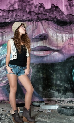 Обои Girl In Front Of Graffiti Wall 240x400