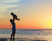 Mother And Child On Beach wallpaper 220x176