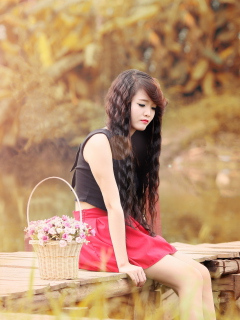 Sad Asian Girl With Flower Basket wallpaper 240x320