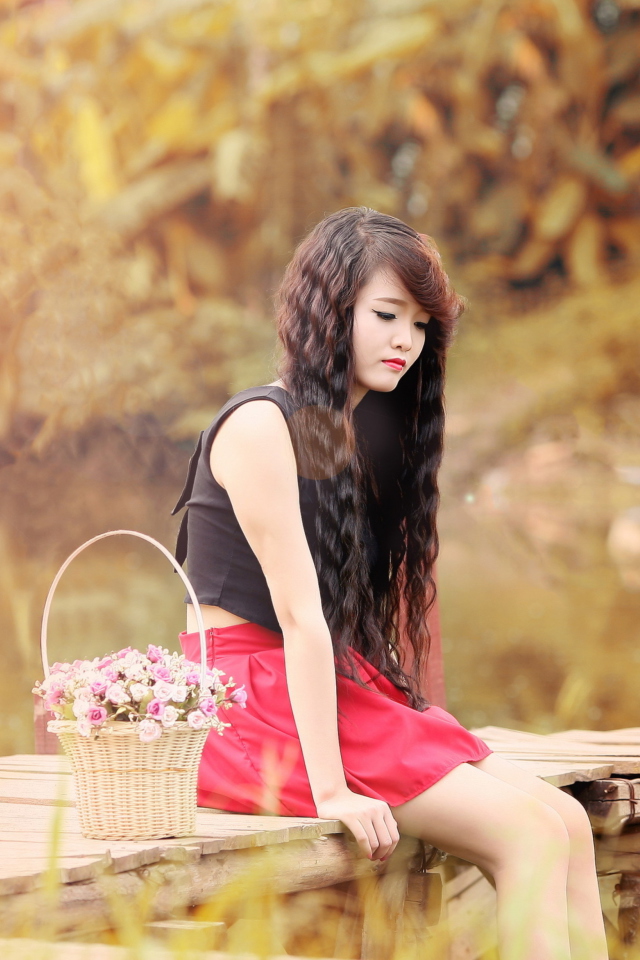 Sad Asian Girl With Flower Basket wallpaper 640x960
