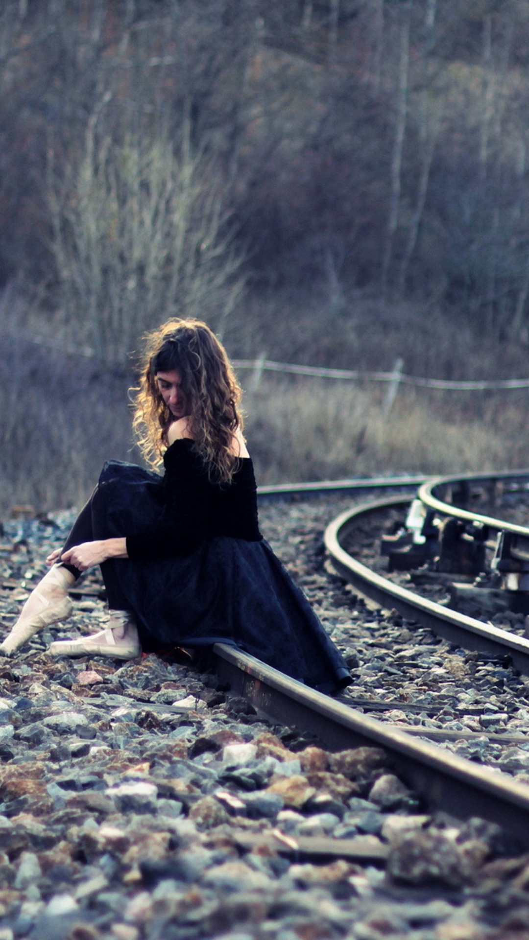 Girl In Black Dress Sitting On Railways wallpaper 1080x1920