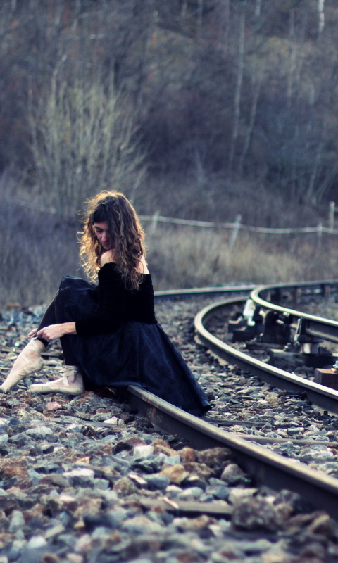 Das Girl In Black Dress Sitting On Railways Wallpaper 480x800