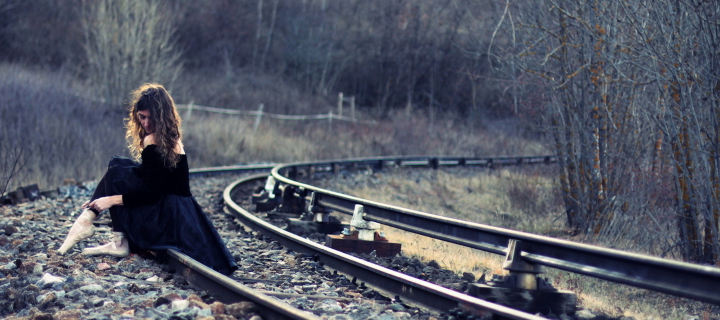 Girl In Black Dress Sitting On Railways screenshot #1 720x320