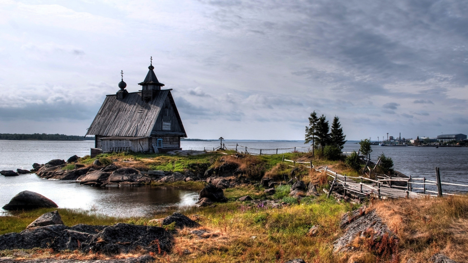 Old small house on the rocky river shore wallpaper 1600x900