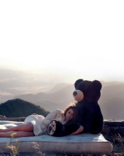 Sfondi Girl Hugging A Big Teddy Bear 176x220