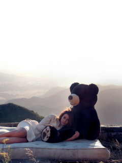 Das Girl Hugging A Big Teddy Bear Wallpaper 240x320