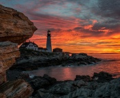 Sunset and lighthouse wallpaper 176x144