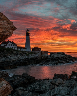Free Sunset and lighthouse Picture for 240x320