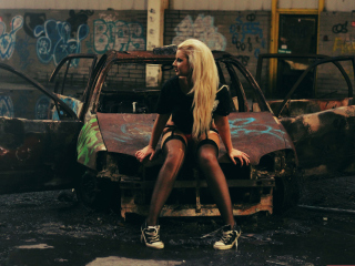 Blonde Girl And Old Scrap Car wallpaper 320x240