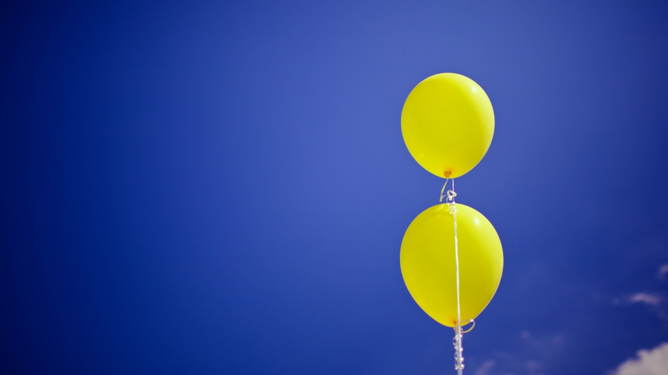Yellow Balloons In The Blue Sky wallpaper 1366x768