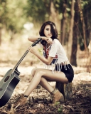 Pretty Brunette Model With Guitar At Meadow wallpaper 128x160