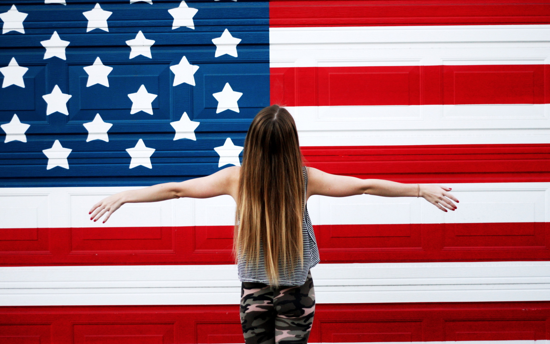 Обои American Girl In Front Of USA Flag 1920x1200