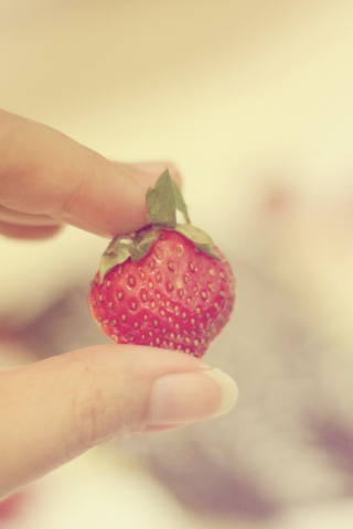 Strawberry In Her Hand wallpaper 320x480