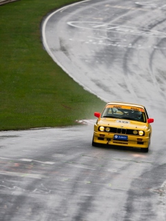 Old Bmw On Speedway wallpaper 240x320