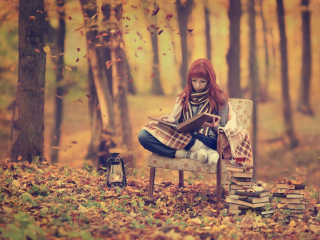 Das Girl Reading Old Books In Autumn Park Wallpaper 320x240