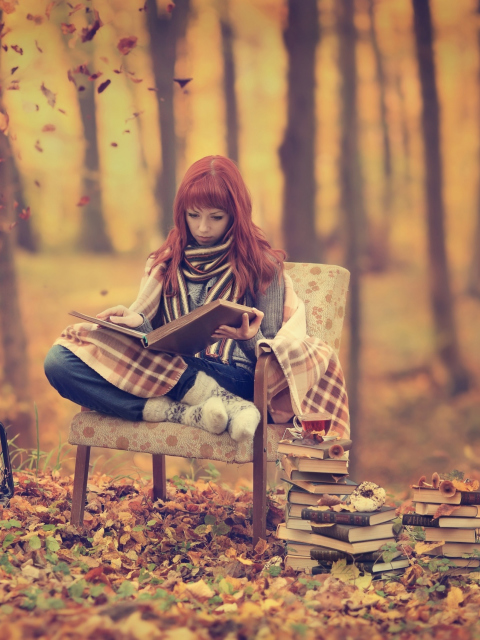 Das Girl Reading Old Books In Autumn Park Wallpaper 480x640