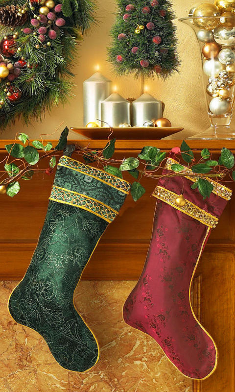 Обои Christmas stocking on fireplace 480x800