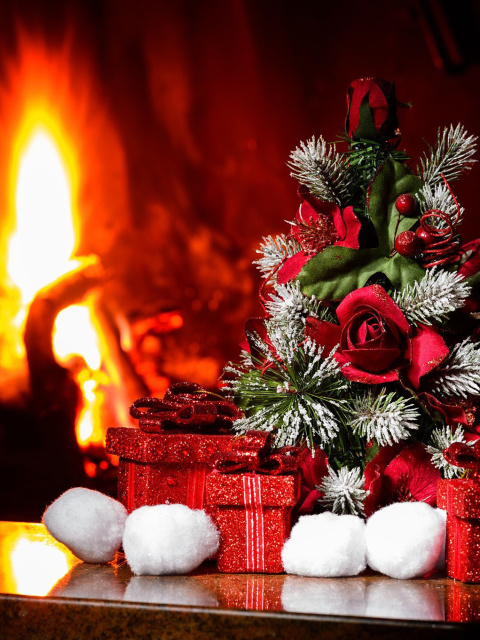 Обои Christmas near Fireplace 480x640