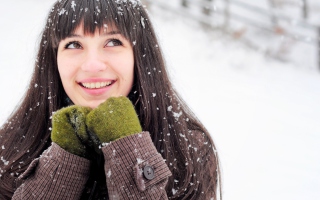Brunette With Green Gloves In Snow Background for Android, iPhone and iPad