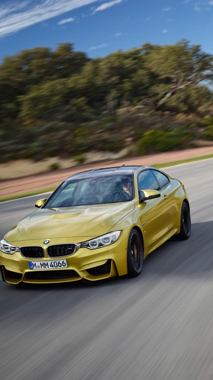 Das 2014 BMW M4 Coupe In Motion Wallpaper 750x1334