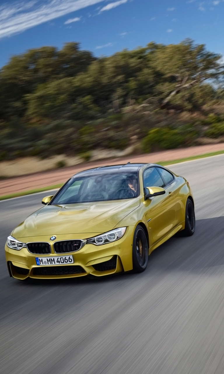 Обои 2014 BMW M4 Coupe In Motion 768x1280