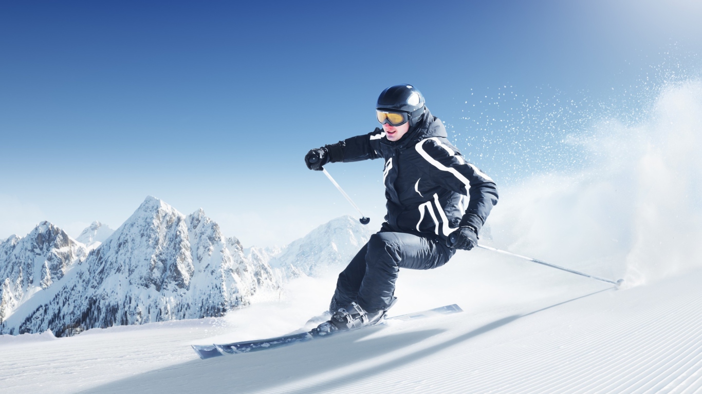 Fondo de pantalla Skiing In Snowy Mountains 1366x768
