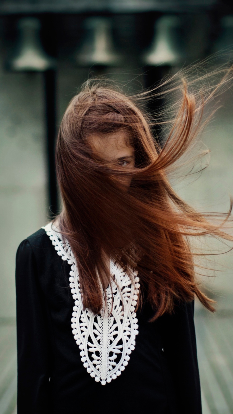 Brunette With Windy Hair wallpaper 750x1334