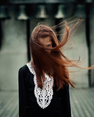 Free Brunette With Windy Hair Picture for iPhone 5S