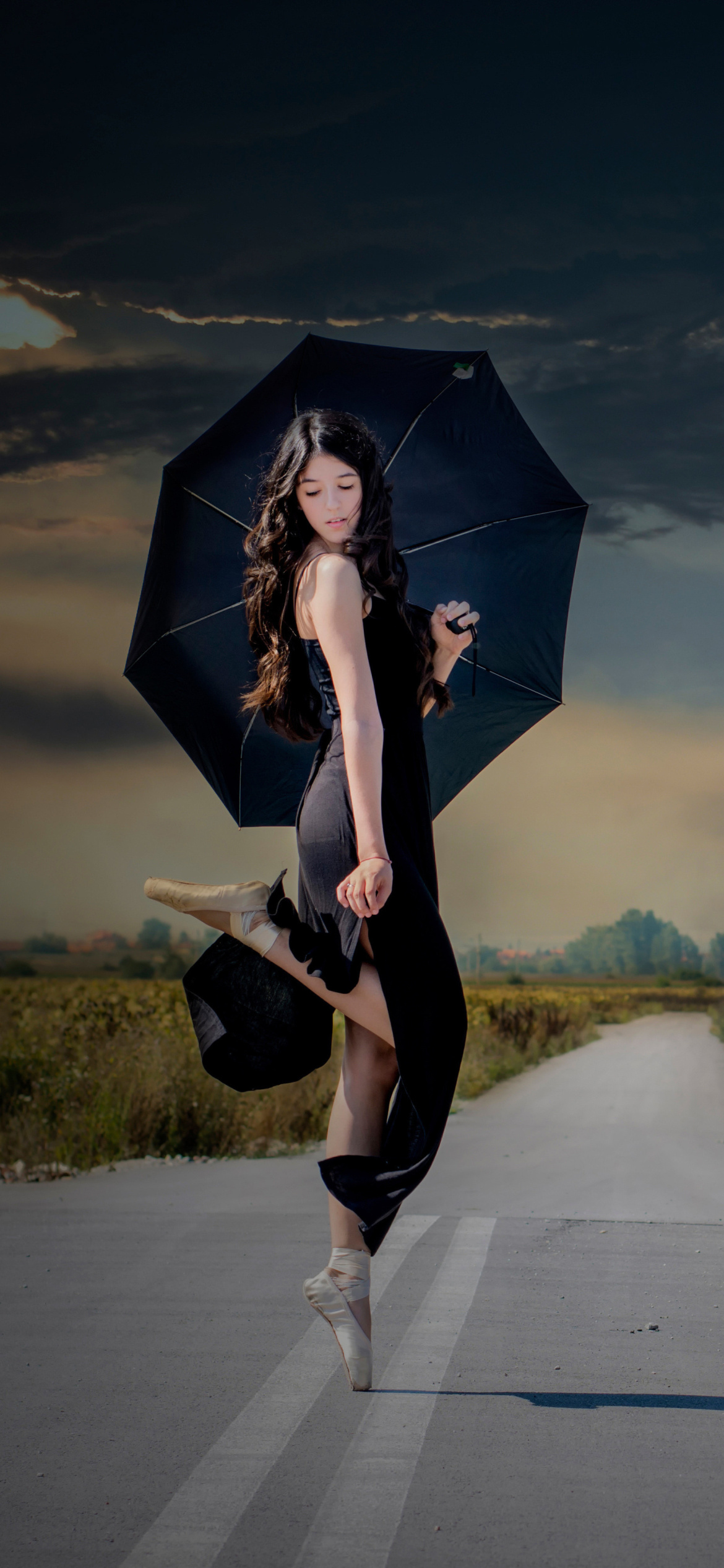 Ballerina with black umbrella wallpaper 1170x2532