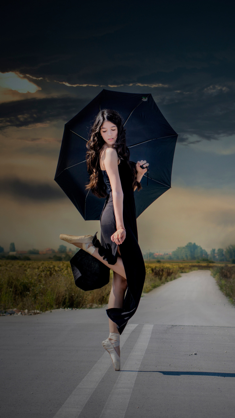 Ballerina with black umbrella wallpaper 750x1334