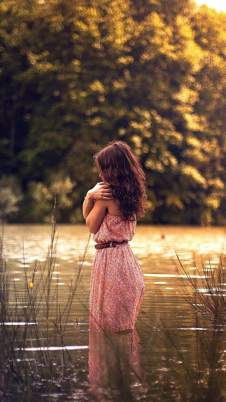 Girl In Summer Dress In River wallpaper 750x1334