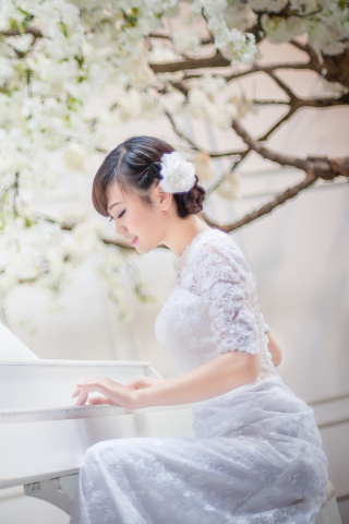 Cute Asian Girl In White Dress Playing Piano wallpaper 320x480