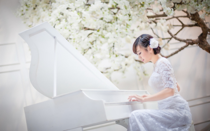 Cute Asian Girl In White Dress Playing Piano wallpaper