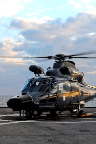Fondo de pantalla Helicopter on Aircraft Carrier 320x480