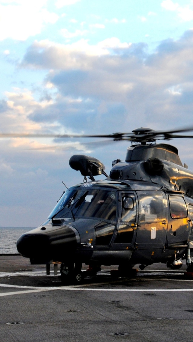 Fondo de pantalla Helicopter on Aircraft Carrier 640x1136