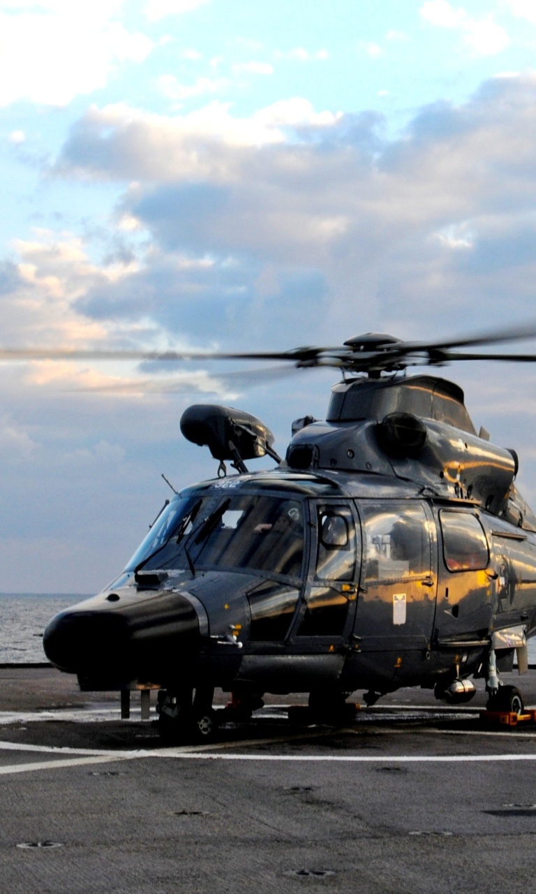 Обои Helicopter on Aircraft Carrier 768x1280