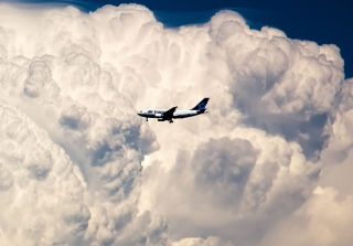Plane In The Clouds Wallpaper for Android, iPhone and iPad