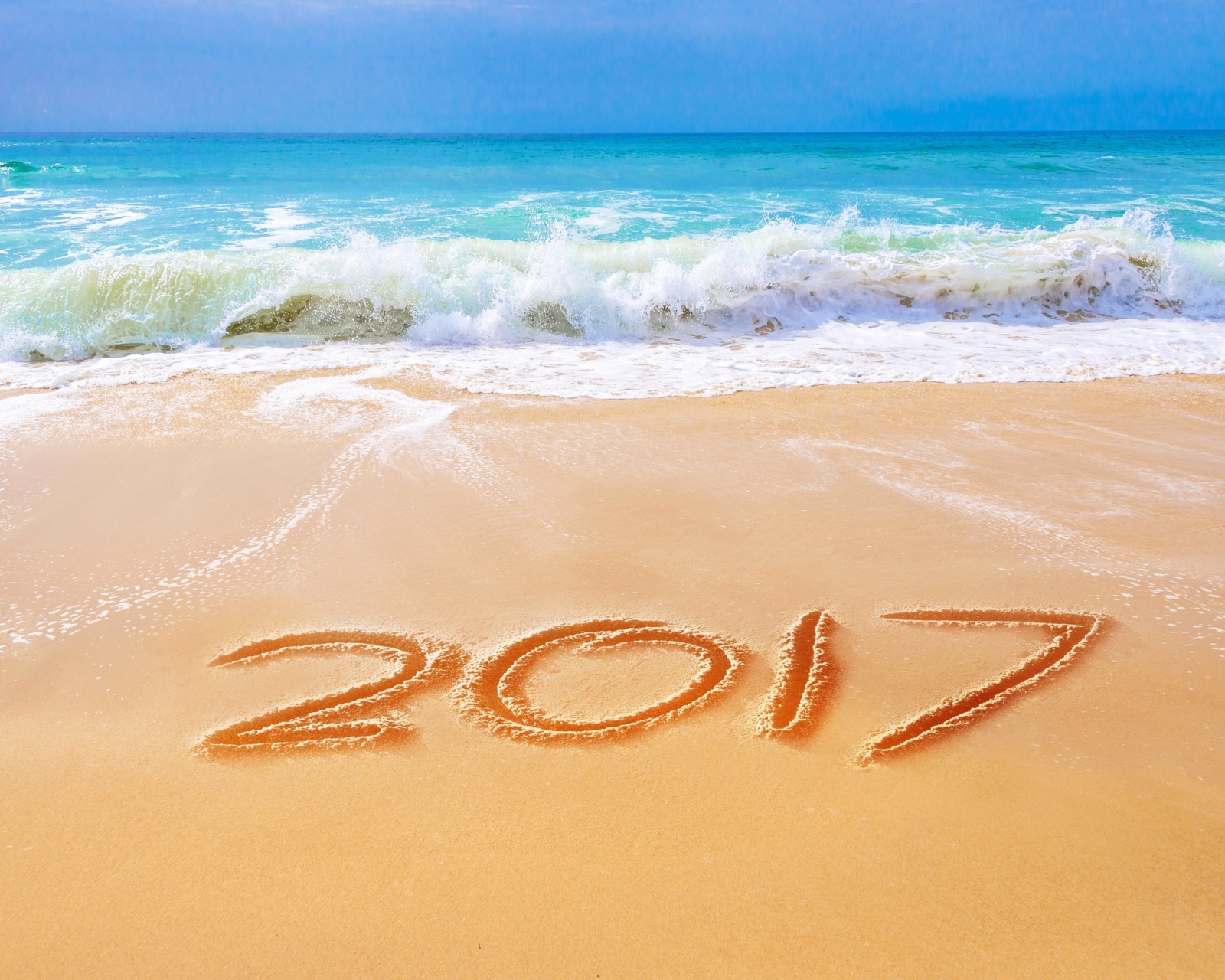 Обои Happy New Year 2017 Phrase on Beach 1600x1280