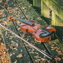 Violin on bench wallpaper 128x128