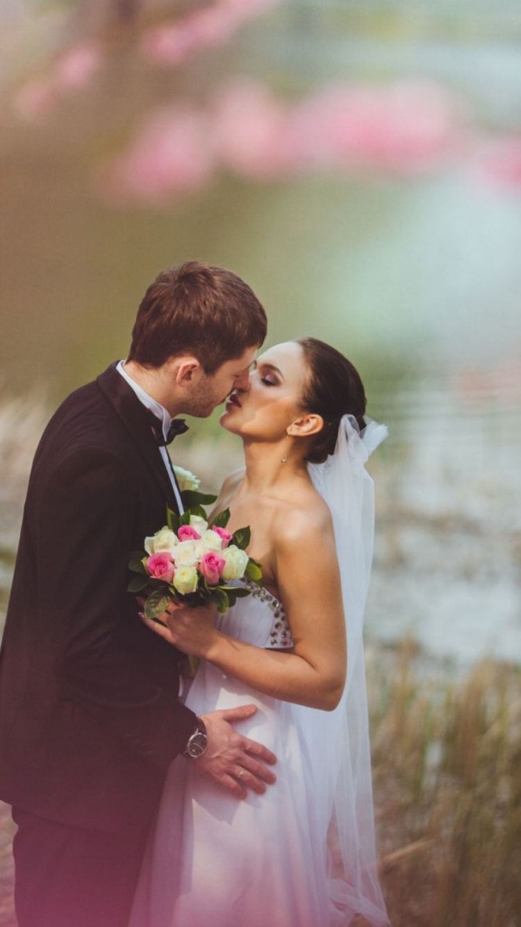 Bride And Groom First Kiss wallpaper 750x1334