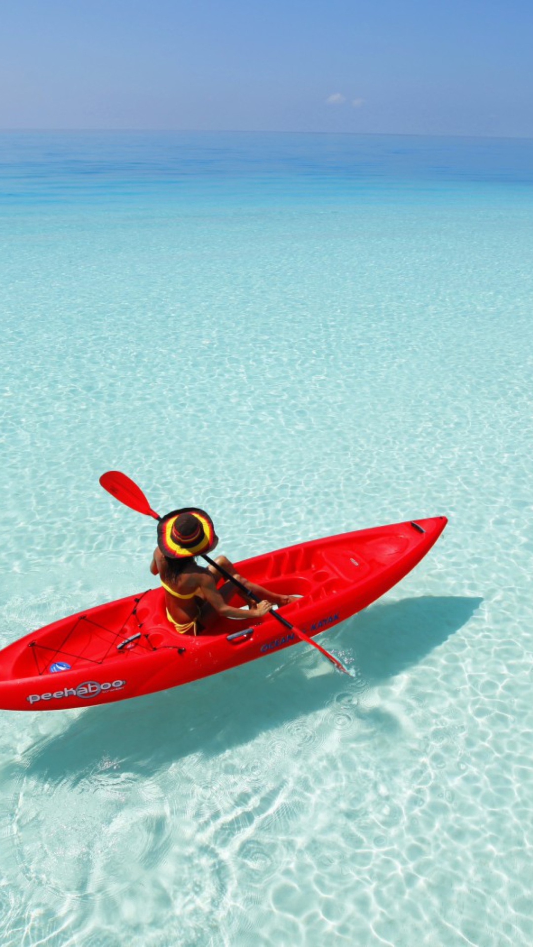 Fondo de pantalla Red Kayak And Transparent Water 1080x1920