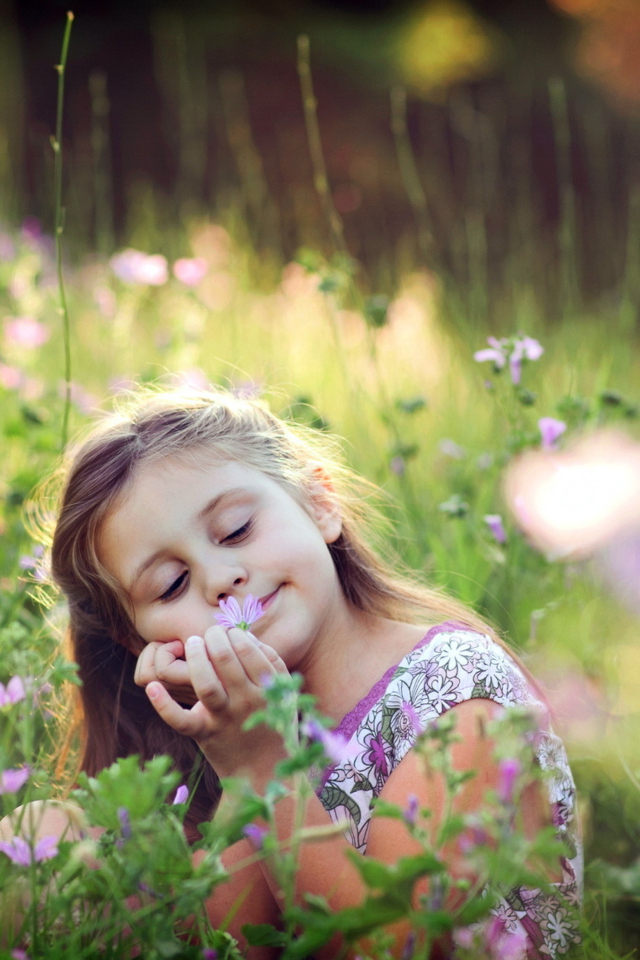 Little Girl Enjoying Nature wallpaper 640x960