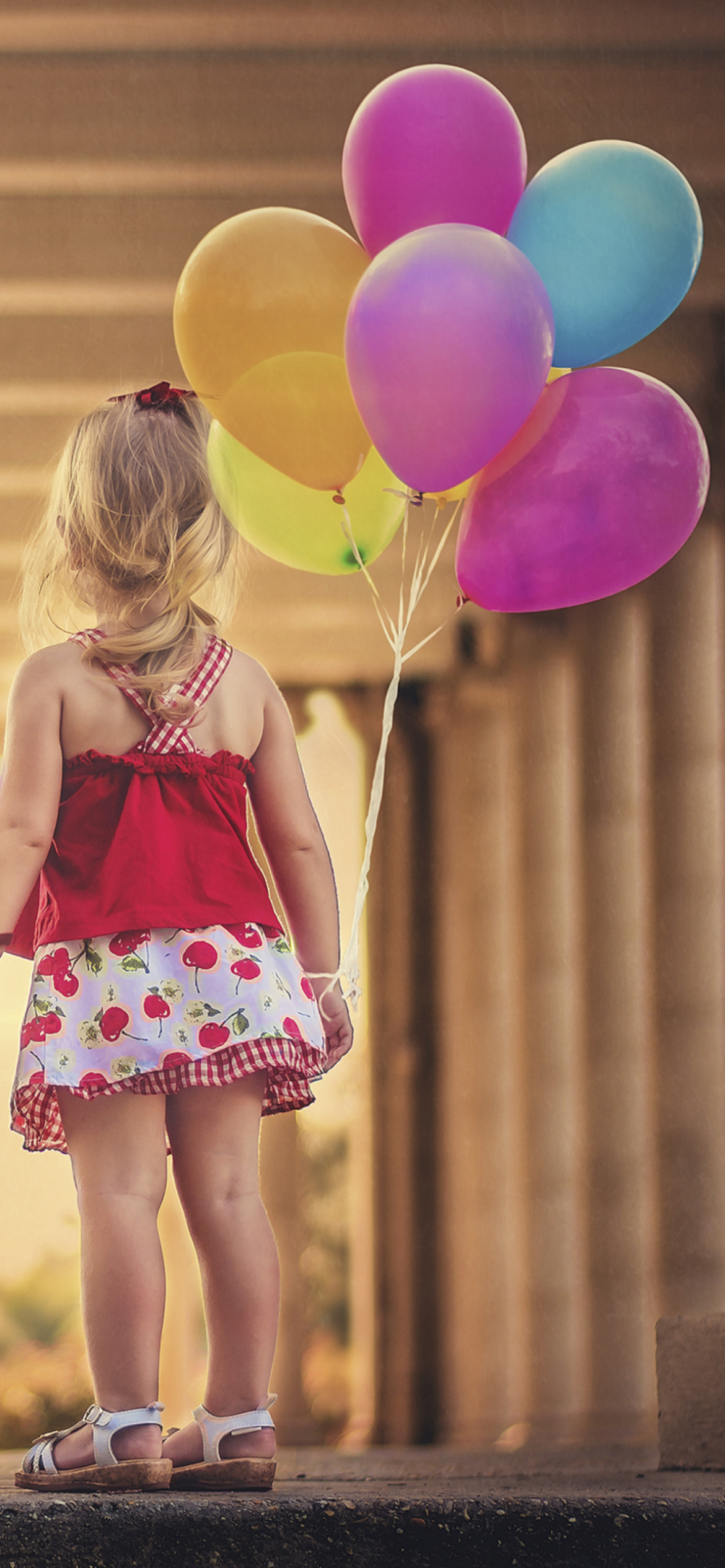 Little Girl With Colorful Balloons wallpaper 1170x2532