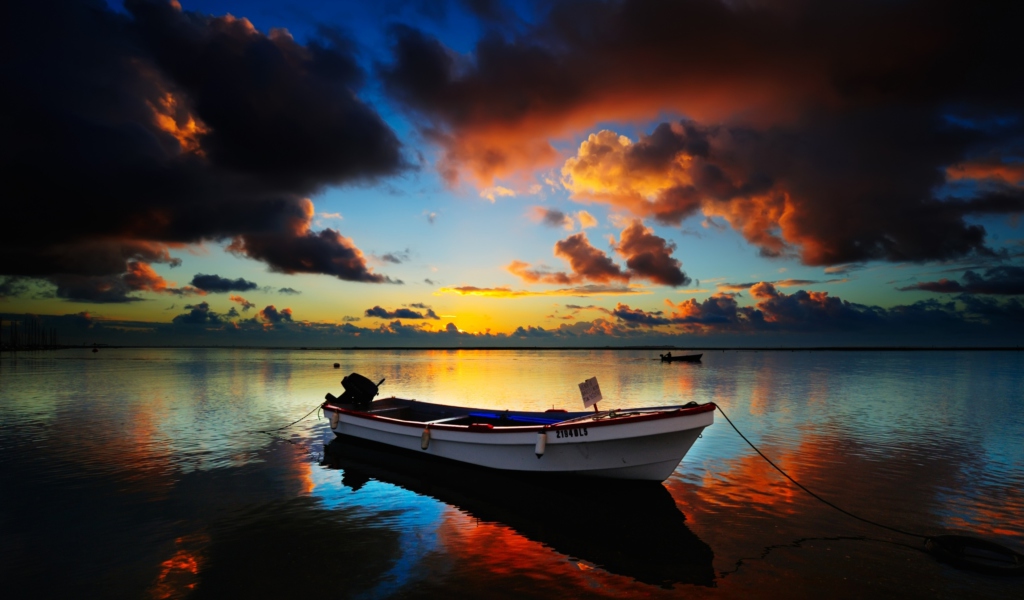 Boat In Sea At Sunset wallpaper 1024x600