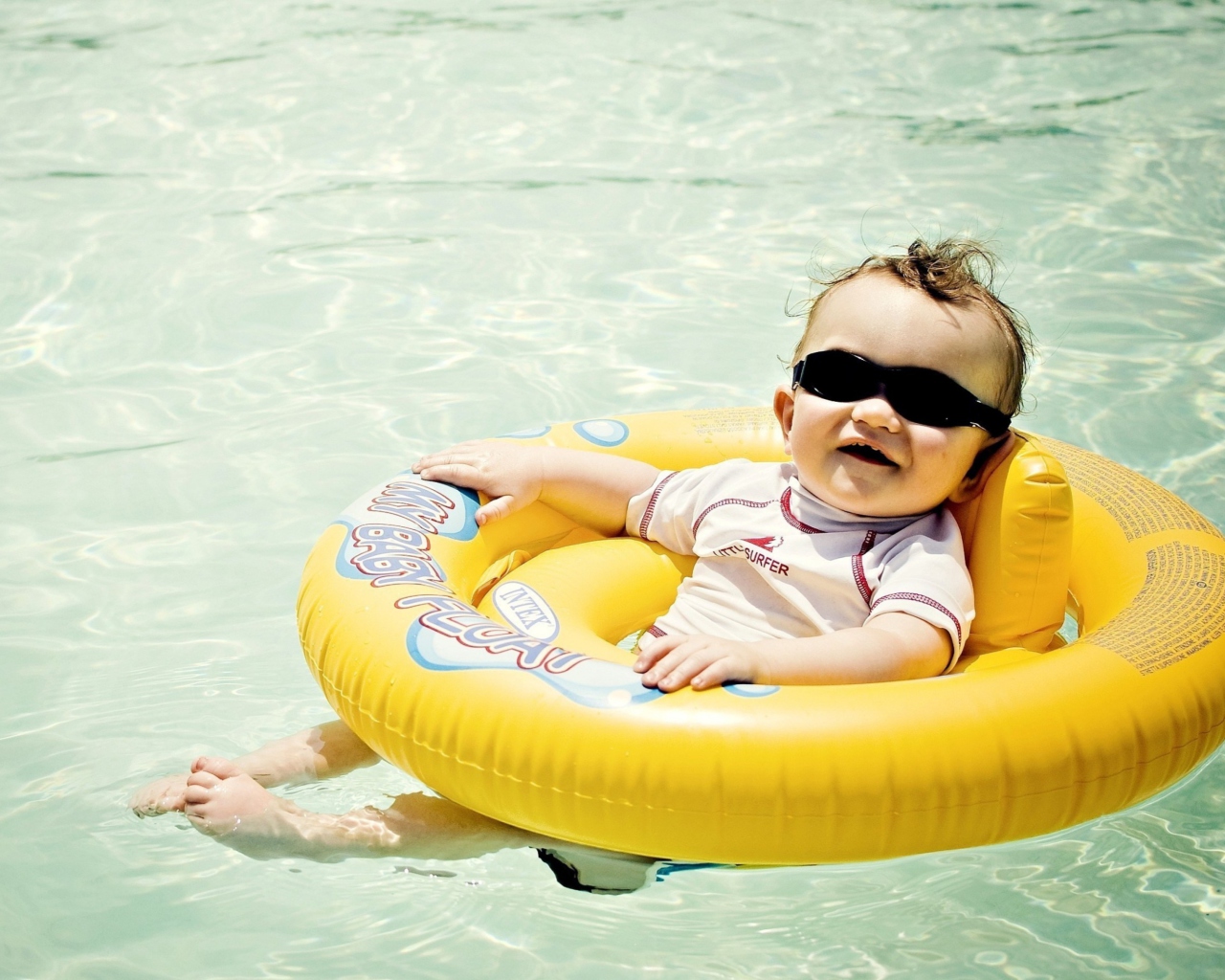 Cute Baby Boy Having Fun In Pool wallpaper 1280x1024