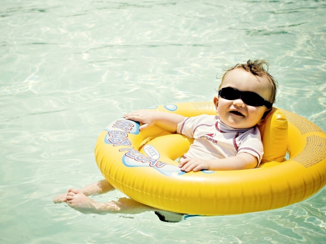 Cute Baby Boy Having Fun In Pool wallpaper 640x480