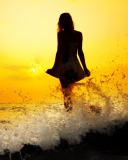 Girl Silhouette In Sea Waves At Sunset wallpaper 128x160