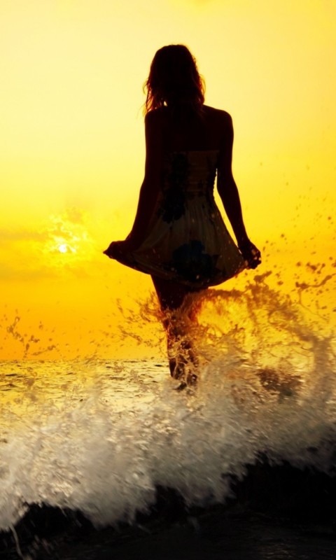 Girl Silhouette In Sea Waves At Sunset wallpaper 480x800